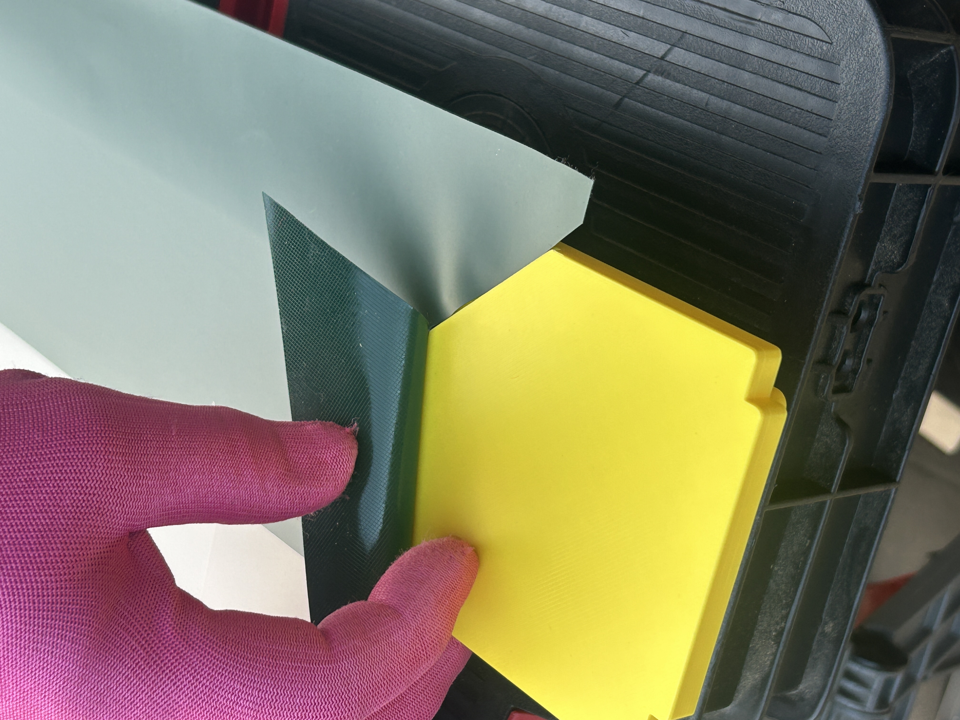 Vinyl material flexibility demonstration with professional handling